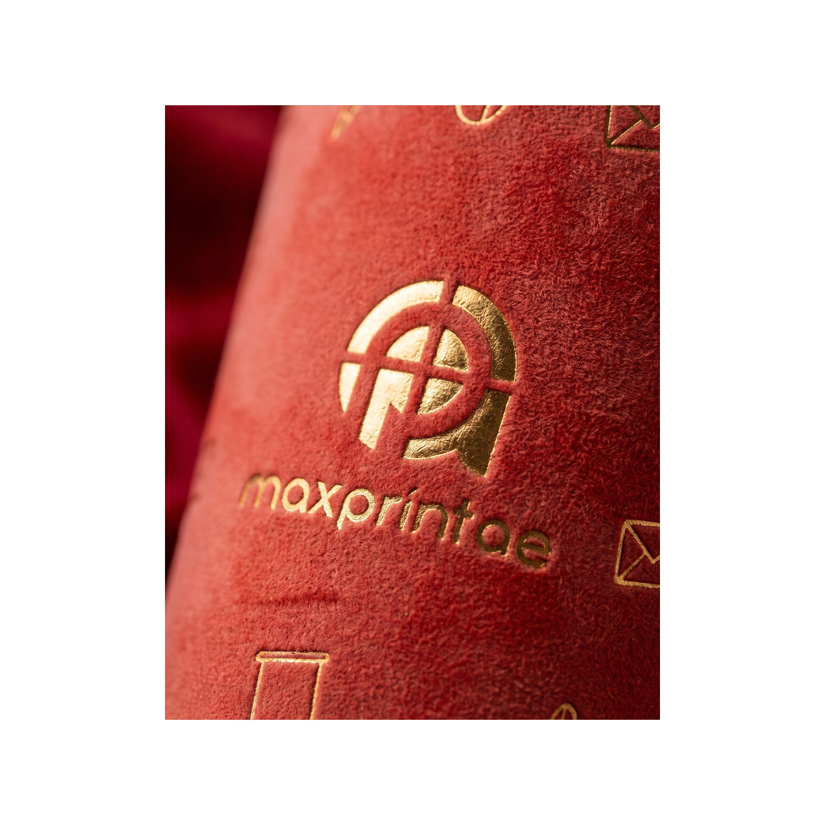 Close-up of gold foil stamped on red velvet paper cup — MaxPrint Dubai