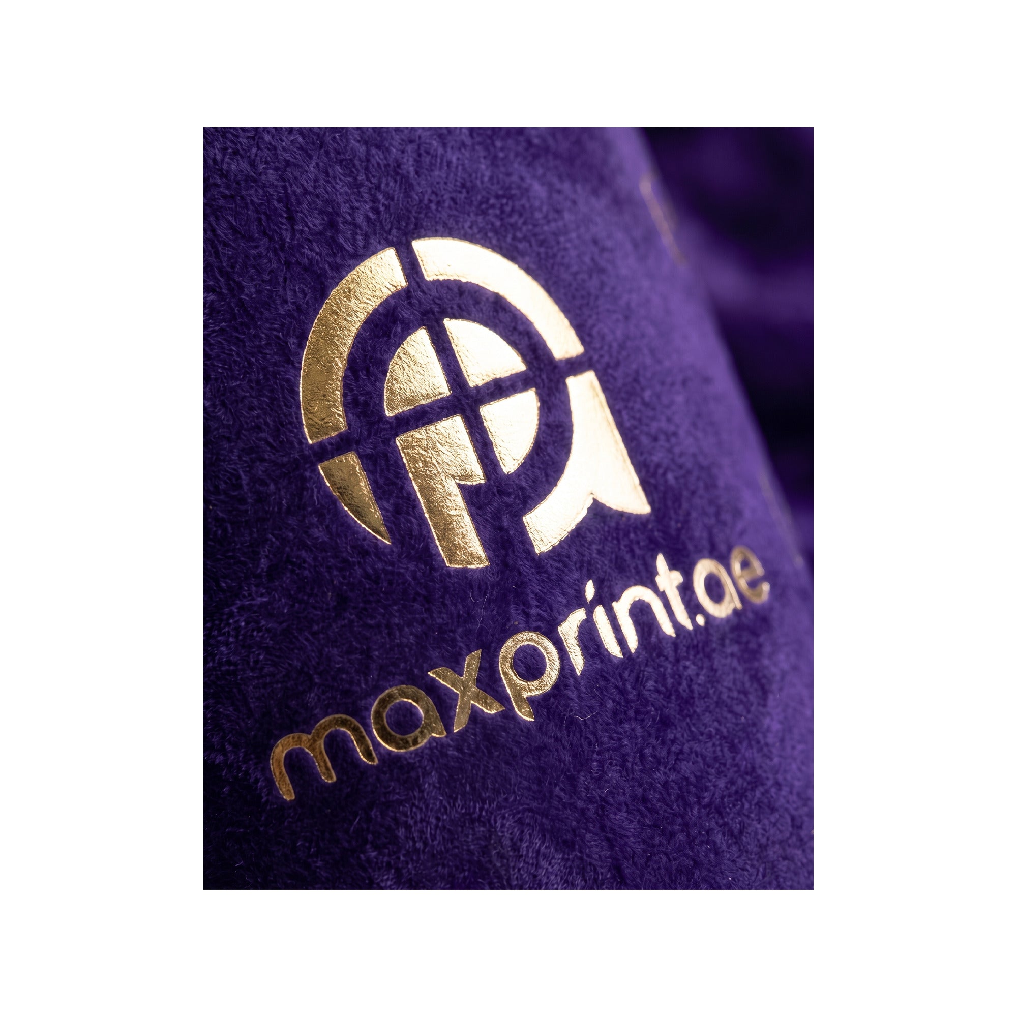 Close-up of gold foil stamped on purple velvet paper cup — MaxPrint Dubai