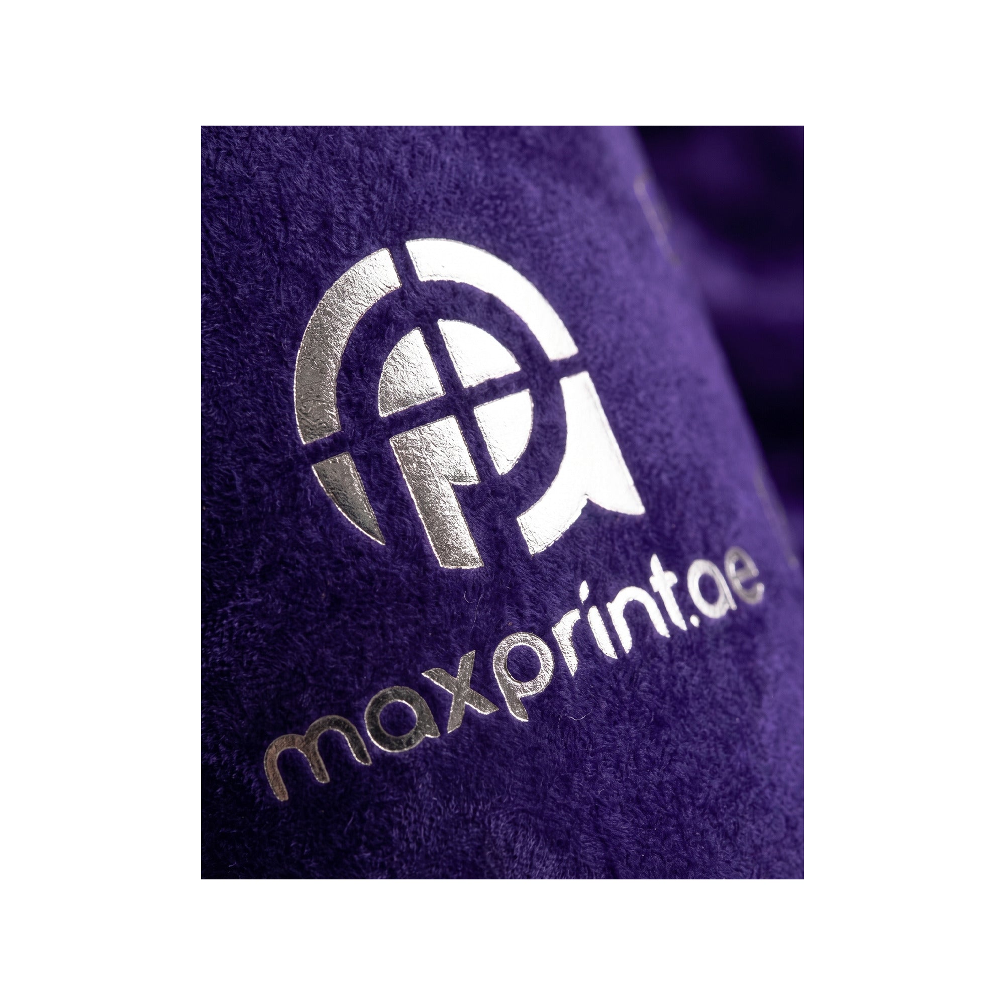 Close-up of silver foil stamped on purple velvet paper cup — MaxPrint Dubai