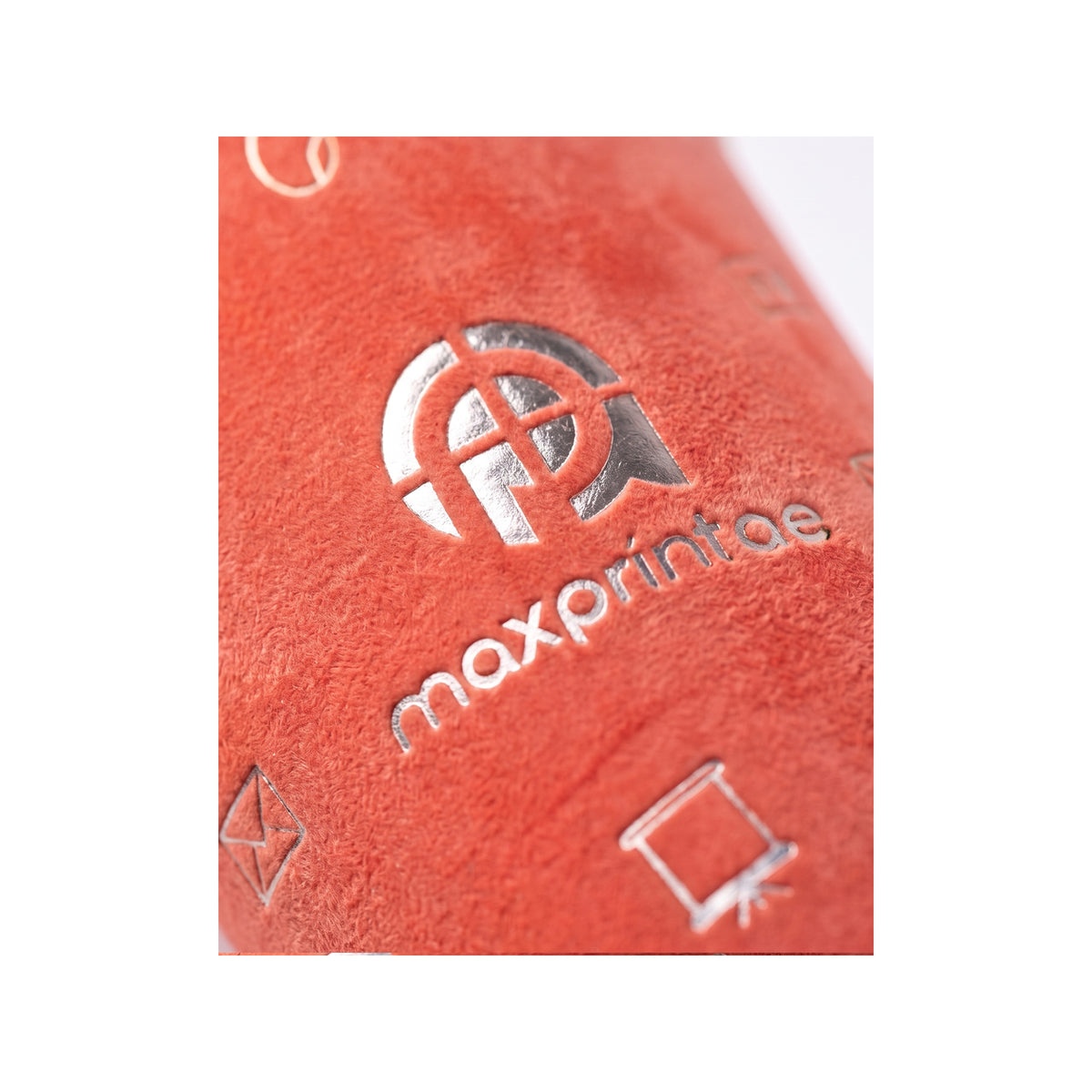 Close-up of silver foil stamped on coral velvet paper cup — MaxPrint Dubai