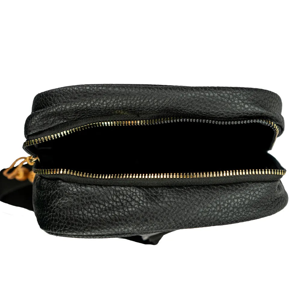 Open view of the crossbody bag main compartment